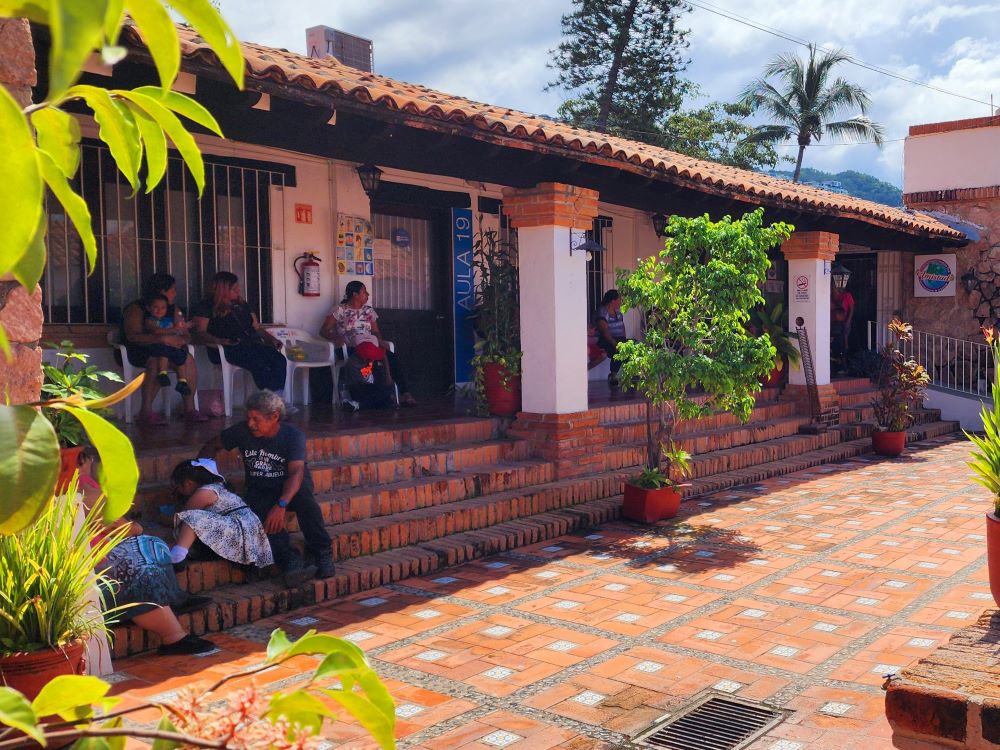 Parents Wait With Their Children at The IFC Cleft Palate Clinic for Assessment